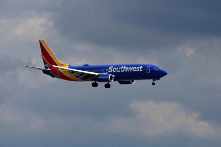 Southwest cancellation policy - A Southwest Airlines commercial aircraft approaches to land.
