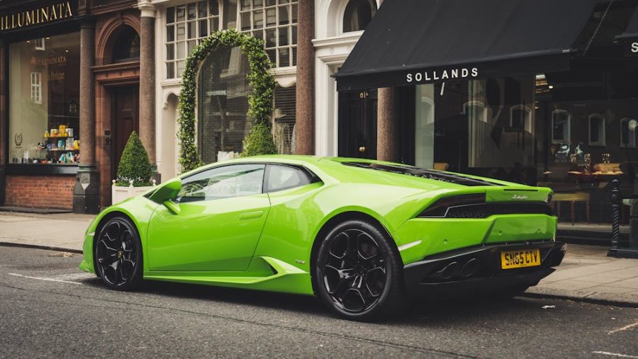 Who owns Lamborghini - Image of parked lime green Lamborghini.