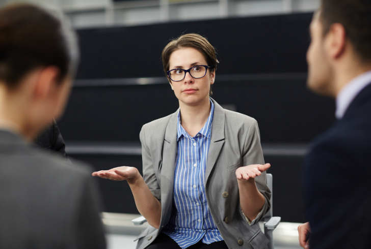 Woman speaking in office meeting